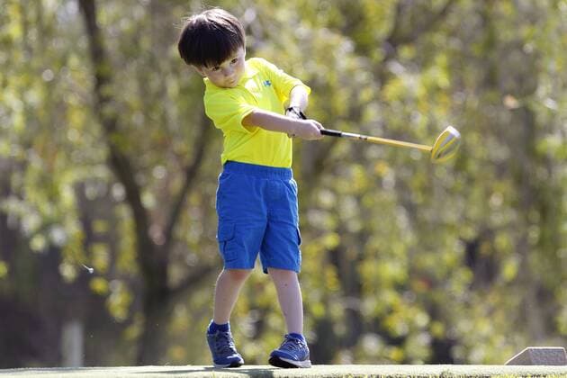 July 14, 2015 - San Diego, California, United States - July 14, 2015_San Diego, CA_USA_ James Grimes III, 4, tees off during the first round of the Junior World Golf Championships 6 and under division at Colina Park Golf Course. Photo by James Grimes III, 4, tees off during the first round of the Junior World Golf Championships 6 and under division at Colina Park Golf Course. - ZUMAs44_