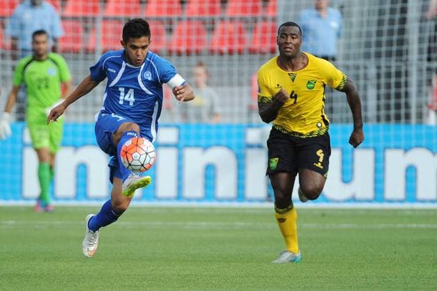 July 14, 2015: El Salvador MF Andres Flores (14) and Jamaica D Westley Morgan (4) in action during the CONCACAF Gold Cup game between Jamaica and El Salvador at BMO Field in Toronto, Ont. SOCCER: JUL 14 CONCACAF Gold Cup - Group Stage - Jamaica v El Salvador Icon15071407 EDITORIAL USE ONLY