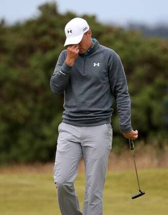 American Jordan Spieth reacts after getting a bogey on the ninth hole during the third round at the 144th Open Championship, St.Andrews on July 19 2015.  LON2015071904 HUGOxPHILPOTT