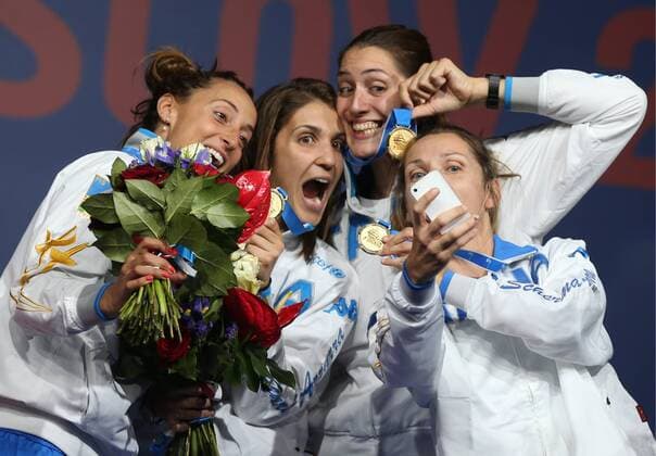 MOSCOW, RUSSIA. JULY 19, 2015. Gold medalists Elisa Di Francisca, Arianna Errigo, Martina Batini, and Valentina Vezzali (L-R) of Italy pose for a selfie at the victory ceremony for the women s team foil event at the 2015 FIE World Fencing Championships, in Olympiysky Sports Complex. Artyom Korotayev TASS  TS008012
