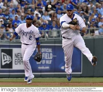 July 21, 2015 - Kansas City, MO, USA - Kansas City Royals third baseman Mike Moustakas, right, throws out the Pittsburgh Pirates Starling Marte at first on a grounder in the fourth inning as shortstop Alcides Escobar (2) backs up the play on Tuesday, July 21, 2015, at Kauffman Stadium in Kansas City, Mo. Pittsburgh at Kansas City - ZUMAm67_