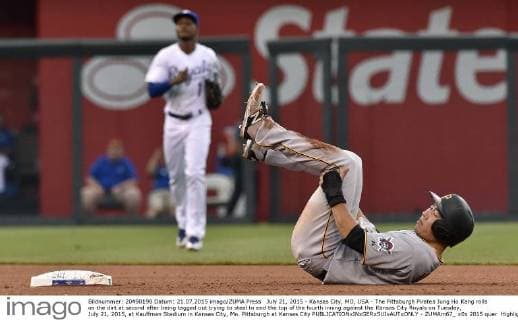 July 21, 2015 - Kansas City, MO, USA - The Pittsburgh Pirates Jung Ho Kang rolls on the dirt at second after being tagged out trying to steal to end the top of the fourth inning against the Kansas City Royals on Tuesday, July 21, 2015, at Kauffman Stadium in Kansas City, Mo. Pittsburgh at Kansas City - ZUMAm67_