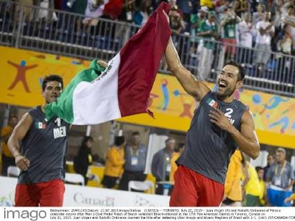 (150722) -- TORONTO, July 22, 2015-- Juan Virgen (R) and Rodolfo Ontiveros of Mexico celebrate victory after Men s Gold Medal Match of Beach volleyball Beachvolleyball at the 17th Pan American Games in Toronto, Canada on July 21, 2015. Juan Virgen and Rodolfo Ontiveros claimed the title after defeating Vitor Araujo and Alvaro Magliano of Brazil with 2-1. )(wll) (SP)CANADA-TORONTO-PAN AM GAMES-BEACH VOLLEYBALL ZouxZheng 