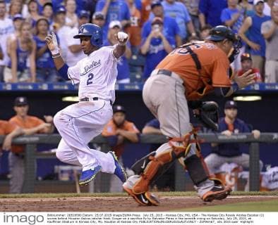 July 25, 2015 - Kansas City, MO, USA - The Kansas City Royals Alcides Escobar (2) scores behind Houston Astros catcher Hank Conger on a sacrifice fly by Salvador Perez in the seventh inning on Saturday, July 25, 2015, at Kauffman Stadium in Kansas City, Mo. Houston at Kansas City - ZUMAm67_