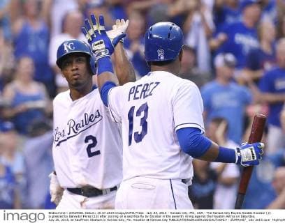July 25, 2015 - Kansas City, MO, USA - The Kansas City Royals Alcides Escobar (2) is greeted by Salvador Perez (13) after scoring on a sacrifice fly by Escobar in the seventh inning against the Houston Astros on Saturday, July 25, 2015, at Kauffman Stadium in Kansas City, Mo. Houston at Kansas City - ZUMAm67_