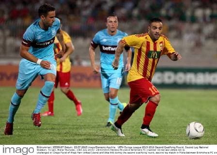 UEFA Europa League 2015-2016 Second Qualifying Round, Second Leg National Stadium, Ta Qali, Malta Thursday, 23rd July 2015 - 23 07 2015 Fabrizio Miccoli of Birkirkara FC (number 10 red and yellow kit) is challenged by Diego Poyet of West Ham United (claret and blue kit) during the second qualifying round, second leg match in Malta between Birirkirkara FC and West Ham United UEFA Europa League 2015 2016 Competition - Second Qualifying Round UEL_2015 16_BKR_WHU