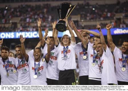 July 26, 2015: Mexico midfielder Andres Guardado (18) holds the CONCACAF Gold Cup Trophy while surrounded by teammates following the CONCACAF Gold Cup 2015 Final match between Jamaica and Mexico at Lincoln Financial Field in Philadelphia, Pennsylvania. Mexico won 3-1. Soccer 2015: Jamaica vs Mexico JUL 26 - ZUMAc04_
