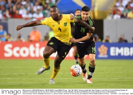 July 26, 2015: Jamaica defender Wes Morgan 4 and Mexico forward Oribe Peralta 19 battle for a loose ball during the 2015 CONCACAF Gold Cup final between Jamaica and Mexico at Lincoln Financial Field in Philadelphia, Pennsylvania. Mexico defeated Jamaica 3-1. Soccer 2015: Jamaica vs Mexico JUL 26 - ZUMAc04_