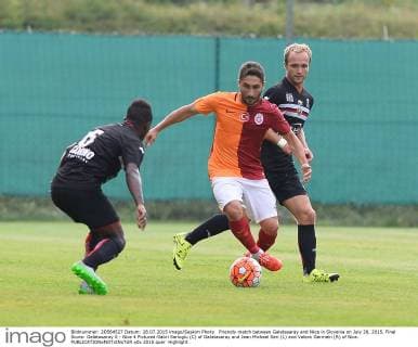 Friendly match between Galatasaray and Nice in Slovenia on July 28, 2015. Final Score: Galatasaray 0 - Nice 4 Pictured:Sabri Sarioglu (C) of Galatasaray and Jean Michael Seri (L) and Valera Germein (R) of Nice. 