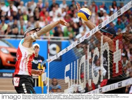 Beach volleyball Beachvolleyball - CEV European Championships 2015 KLAGENFURT,AUSTRIA,30.JUL.15 - BEACH VOLLEYBALL - CEV Beach Volleyball European Championships. Image shows Tobias Winter (AUT) and Mariusz Prudel (POL). GEPAxpictures xDanielxGoetzhaber