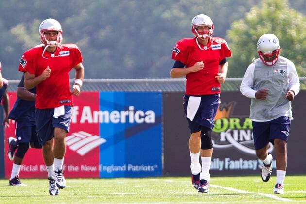 July 30, 2015; Foxborough, MA, USA: New England Patriots quarterbacks Jimmy Garoppolo (10) (left) and Tom Brady during NFL American Football Herren USA training camp at Gillette Stadium. NFL 2015: Patriots Training Camp JUL 30 - ZUMAc04_