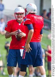 July 30, 2015; Foxborough, MA, USA: New England Patriots quarterbacks Jimmy Garoppolo (10) (left) and Tom Brady (12) during NFL American Football Herren USA training camp at Gillette Stadium. NFL 2015: Patriots Training Camp JUL 30 - ZUMAc04_