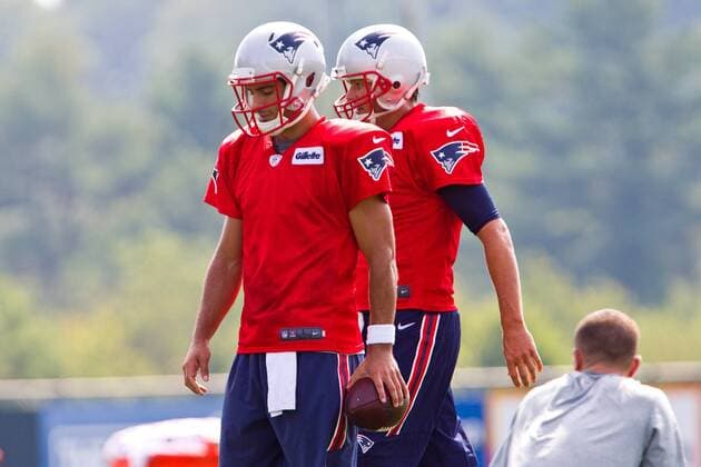 July 30, 2015; Foxborough, MA, USA: New England Patriots quarterbacks Jimmy Garoppolo (10) and Tom Brady (12) during NFL American Football Herren USA training camp at Gillette Stadium. NFL 2015: Patriots Training Camp JUL 30 - ZUMAc04_