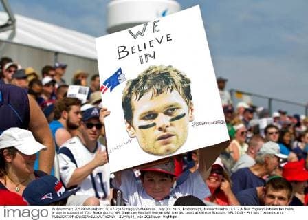 July 30, 2015; Foxborough, Massachusetts, U.S. - A New England Patriots fan holds a sign in support of Tom Brady during NFL American Football Herren USA training camp at Gillette Stadium. NFL 2015 - Patriots Training Camp - ZUMAc04_