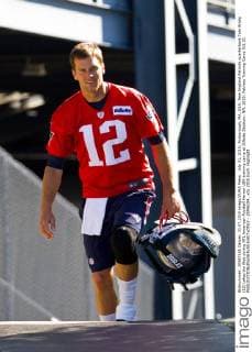 July 31, 2015; Foxborough, MA, USA: New England Patriots quarterback Tom Brady (12) takes the filed during NFL American Football Herren USA training camp at Gillette Stadium. NFL 2015: Patriots Training Camp JUL 31 - ZUMAc04_