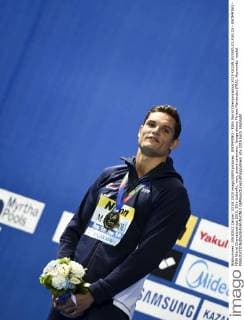 SWIMMING - FINA World Championships 2015 KAZAN,RUSSIA,03.AUG.15 - SWIMMING - FINA World Championships 2015, 50m butterfly, men, award ceremony. Image shows Florent Manaudou (FRA). Keywords: medal. GEPAxpictures xPhilippxBrem