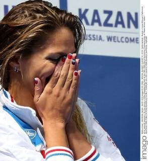 KAZAN, RUSSIA. AUGUST 4, 2015. Gold medalist, Russia s Yuliya Efimova (Yefimova) at an awards ceremony for the women s 100m Breaststroke final at the 16th FINA World Swimming Championships, at Kazan Arena. Valery Sharifulin TASS  TS009182