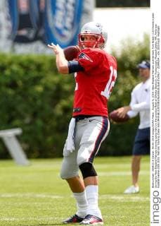 August 4, 2015: New England Patriots quarterback Tom Brady (12) throws a pass during the New England Patriots training camp held on the practice field at Gillette Stadium, in Foxborough, Massachusetts. NFL American Football Herren USA 2015: Patriots Training Camp AUG 04 - ZUMAc04_