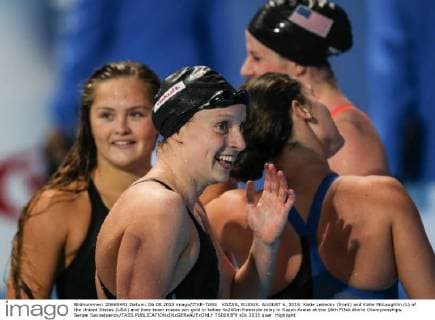 KAZAN, RUSSIA. AUGUST 6, 2015. Katie Ledecky (front) and Katie McLaughlin (L) of the United States (USA) and their team mates win gold in ladies 4x200m freestyle relay in Kazan Arena at the 16th FINA World Championships. Sergei Savostyanov TASS  TS0093F9