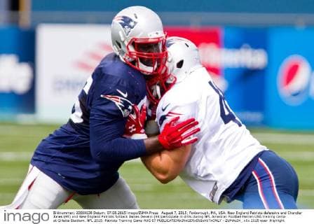 August 7, 2015; Foxborough, MA, USA: New England Patriots defensive end Chandler Jones (95) and New England Patriots fullback James Develin (46)participate in drills during NFL American Football Herren USA training camp at Gillette Stadium. NFL 2015: Patriots Training Camp AUG 07 - ZUMAc04_
