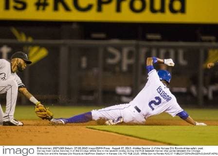 August 07, 2015: Alcides Escobar 2 of the Kansas City Royals slides safely past the tag from Carlos Sanchez 5 of the Chicago White Sox in the seventh inning during the MLB Baseball Herren USA game between the Chicago White Sox and the Kansas City Royals at Kauffman Stadium in Kansas City MO MLB 2015: White Sox vs Royals AUG 07 - ZUMAc04_