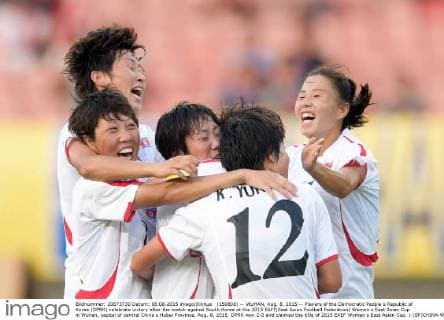 (150808) -- WUHAN, Aug. 8, 2015 -- Players of the Democratic People s Republic of Korea (DPRK) celebrate victory after the match against South Korea at the 2015 EAFF(East Asian Football Federation) Women s East Asian Cup in Wuhan, capital of central China s Hubei Province, Aug. 8, 2015. DPRK won 2-0 and claimed the title of 2015 EAEF Women s East Asian Cup. ) (SP)CHINA-WUHAN-FOOTBALL-EAFF EAST ASIAN CUP 2015-WOMEN-CHAMPIONSHIP chengxmin 