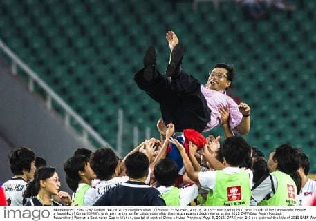 (150808) -- WUHAN, Aug. 8, 2015 -- Kim Kwang Min, head coach of the Democratic People s Republic of Korea (DPRK), is thrown to the air for celebration after the match against South Korea at the 2015 EAFF(East Asian Football Federation) Women s East Asian Cup in Wuhan, capital of central China s Hubei Province, Aug. 8, 2015. DPRK won 2-0 and claimed the title of 2015 EAEF Women s East Asian Cup. ) (SP)CHINA-WUHAN-FOOTBALL-EAFF EAST ASIAN CUP 2015-WOMEN-CHAMPIONSHIP XiaoxYijiu 