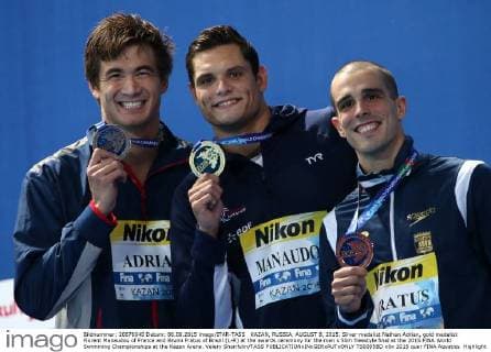 KAZAN, RUSSIA. AUGUST 8, 2015. Silver medalist Nathan Adrian, gold medalist Florent Manaudou of France and Bruno Fratus of Brazil (L-R) at the awards ceremony for the men s 50m freestyle final at the 2015 FINA World Swimming Championships at the Kazan Arena. Valery Sharifulin TASS  TS0095BD