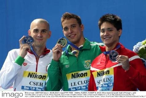 KAZAN, RUSSIA. AUGUST 8, 2015. Silver medalist Laszlo Cseh of Hungary, gold medalist Chad Le Clos of South Africa Republic and bronze medalist Joseph Isaac Schooling of Singapore (L-R) at the awards ceremony for the men s 100m butterfly final at the 2015 FINA World Swimming Championships at the Kazan Arena. Valery Sharifulin TASS  TS009607