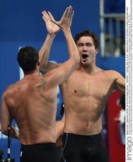 (150809) -- KAZAN, Aug. 8, 2015 --Nathan Adrian (R) and Ryan Lochte of the relay team of the United States celebrate after the mixed 4x100m freestyle relay final at FINA World Championships in Kazan, Russia, Aug. 8, 2015. The United States claimed the title and broke the world record in a time of 3 minutes 23.05 seconds. ) (SP)RUSSIA-KAZAN-FINA WORLD CHAMPIONSHIPS-SWIMMING DaixTianfang 