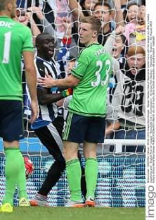 Papiss Demba Cisse of Newcastle United turns with his tongue out after a cheeky equalising goal - English Premier League - Newcastle Utd v Southampton - St James Park Stadium - Newcastle - England - 9th August 2015 - Picture Simon Bellis Sportimage EDITORIAL USE ONLY. No use with unauthorised audio, video, data, fixture lists, club league logos or live services. Online in-match use limited to 120 images, no video emulation. No use in betting, games or single club league player publications.