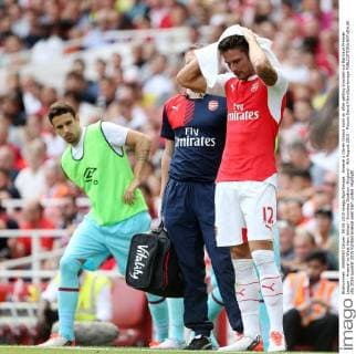 Arsenal s Olivier Giroud looks on after getting knocked out Barclays Premier League - Arsenal vs West Ham United - Emirates Stadium -England - 9th August 2015 - Picture David Klein Sportimage EDITORIAL USE ONLY. No use with unauthorised audio, video, data, fixture lists, club league logos or live services. Online in-match use limited to 120 images, no video emulation. No use in betting, games or single club league player publications.