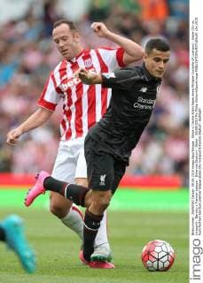 Stoke s Charlie Adam takes down Philippe Coutinho of Liverpool - Stoke City vs. Liverpool - Barclay s Premier League - Britannia Stadium - Stoke - 09 08 2015 Pic Philip Oldham Sportimage EDITORIAL USE ONLY. No use with unauthorised audio, video, data, fixture lists, club league logos or live services. Online in-match use limited to 120 images, no video emulation. No use in betting, games or single club league player publications.