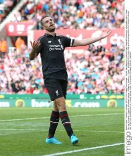 Jordan Henderson of Liverpool looks dejected following a misplaced cross - Stoke City vs. Liverpool - Barclay s Premier League - Britannia Stadium - Stoke - 09 08 2015 Pic Philip Oldham Sportimage EDITORIAL USE ONLY. No use with unauthorised audio, video, data, fixture lists, club league logos or live services. Online in-match use limited to 120 images, no video emulation. No use in betting, games or single club league player publications.