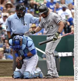 Aug. 9, 2015 - Kansas City, MO, USA - Chicago White Sox s Melky Cabrera (53) checks on Kansas City Royals catcher Salvador Perez (13) after his gloved hand was hit during the third inning on Sunday, Aug. 9, 2015, at Kauffman Stadium in Kansas City, Mo. Chicago White Sox at Kansas City Royals - ZUMAm67_