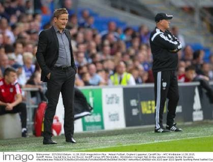 Aktuell FuÃŸball, England Ligapokal, Cardiff City - AFC Wimbledon 11.08.2015. Cardiff, Wales. Capital One Cup 1st Round. Cardiff versus AFC Wimbledon. Wimbledon manager Neil Ardley watches closely during the game. xPaulxJenkinsx  ActionPlus11648569