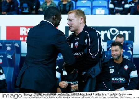 11.08.2015. Bolton, England. Capital One Cup 1st Round. Bolton Wanderers versus Burton Albion. Burton Albion Manager Jimmy Floyd Hasselbaink shakes hands with Bolton Wanderers Manager Neil Lennon xPaulxKeevilx  ActionPlus11648572