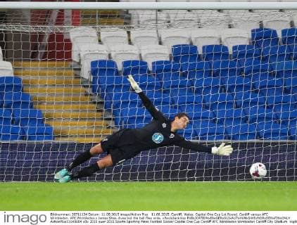 11.08.2015. Cardiff, Wales. Capital One Cup 1st Round. Cardiff versus AFC Wimbledon. AFC Wimbledon s James Shea dives but the ball flies wide. xPaulxJenkinsx  ActionPlus11648604