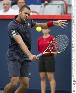 MONTREAL, Aug. 11, 2015 -- Jo-Wilfried Tsonga of France hits a return to Borna Coric of Croatia during the men s singles first round match at the 2015 Rogers Cup in Montreal, Canada, on Aug. 11, 2015. Jo-Wilfried Tsonga won 2-0. ) (SP)CANADA-MONTREAL-TENNIS-ROGERS CUP-MEN S SINGLES AndrewxSoong 
