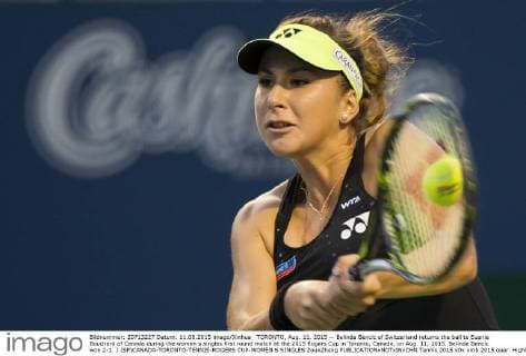TORONTO, Aug. 11, 2015 -- Belinda Bencic of Switzerland returns the ball to Euenie Bouchard of Canada during the women s singles first round match at the 2015 Rogers Cup in Toronto, Canada, on Aug. 11, 2015. Belinda Bencic won 2-1. ) (SP)CANADA-TORONTO-TENNIS-ROGERS CUP-WOMEN S SINGLES ZouxZheng 