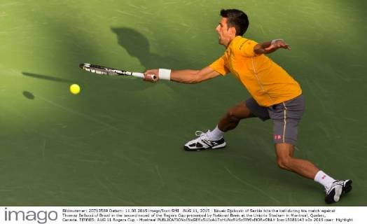 AUG 11, 2015 : Novak Djokovic of Serbia hits the ball during his match against Thomaz Bellucci of Brazil in the second round of the Rogers Cup presented by National Bank at the Uniprix Stadium in Montreal, Quebec, Canada. TENNIS: AUG 11 Rogers Cup - Montreal Icon15081143 EDITORIAL USE ONLY