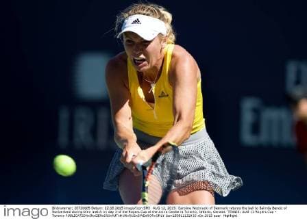 AUG 12, 2015: Caroline Wozniacki of Denmark returns the ball to Belinda Bencic of Switzerland during their match on day 3 of the Rogers Cup at the Aviva Centre in Toronto, Ontario, Canada. TENNIS: AUG 12 Rogers Cup - Toronto Icon150812132433 EDITORIAL USE ONLY