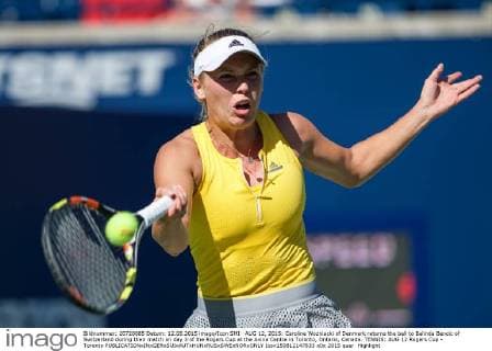 AUG 12, 2015: Caroline Wozniacki of Denmark returns the ball to Belinda Bencic of Switzerland during their match on day 3 of the Rogers Cup at the Aviva Centre in Toronto, Ontario, Canada. TENNIS: AUG 12 Rogers Cup - Toronto Icon150812147833 EDITORIAL USE ONLY
