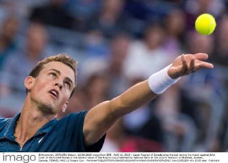 AUG 12, 2015 : Vasek Pospisil of Canada eyes the ball during his match against John Isner of the United States in the second round of the Rogers Cup presented by National Bank at the Uniprix Stadium in Montreal, Quebec, Canada. TENNIS: AUG 12 Rogers Cup - Montreal Icon15081254 EDITORIAL USE ONLY
