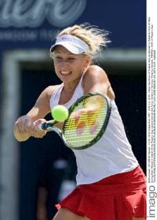 AUG 13, 2015: Daria Gavrilova of Russia returns the ball to Roberta Vinci of Italy during their Round 3 match of the Rogers Cup tournament at the Aviva Centre in Toronto, Ontario, Canada. TENNIS: AUG 13 Rogers Cup - Toronto Icon150813006141 EDITORIAL USE ONLY