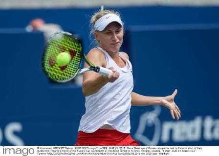 AUG 13, 2015: Daria Gavrilova of Russia returns the ball to Roberta Vinci of Italy during their Round 3 match of the Rogers Cup tournament at the Aviva Centre in Toronto, Ontario, Canada. TENNIS: AUG 13 Rogers Cup - Toronto Icon150813011241 EDITORIAL USE ONLY