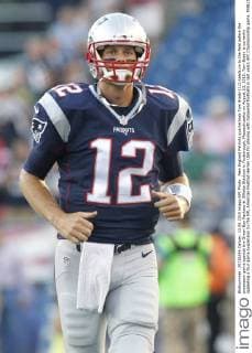 New England Patriots quarterback Tom Brady (12) heads on to the field before the preseason game against the Green Bay Packers at Gillette Stadium in Foxborough, Massachusetts on August 13, 2015. Tom Brady is currently appealing a four game suspension by the NFL American Football Herren USA for playing with tampered footballs in last years AFC Championship game.  BOS20150813102 MATTHEWxHEALEY