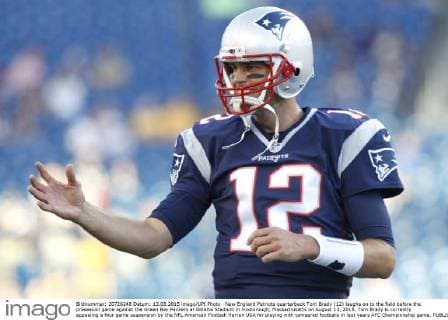 New England Patriots quarterback Tom Brady (12) laughs on to the field before the preseason game against the Green Bay Packers at Gillette Stadium in Foxborough, Massachusetts on August 13, 2015. Tom Brady is currently appealing a four game suspension by the NFL American Football Herren USA for playing with tampered footballs in last years AFC Championship game.  BOS20150813104 MATTHEWxHEALEY