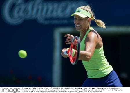 AUG 13, 2015: Angelique Kerber of Germany returns the ball to Simona Halep of Romania during their Round 3 match of the Rogers Cup tournament at the Aviva Centre in Toronto, Ontario, Canada. TENNIS: AUG 13 Rogers Cup - Toronto Icon150813031442 EDITORIAL USE ONLY
