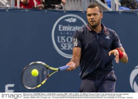 AUG 13, 2015 : Jo-Wilfried Tsonga of France hits the ball during his match against Bernard Tomic of Australia in the third round of the Rogers Cup presented by National Bank at the Uniprix Stadium in Montreal, Quebec, Canada. TENNIS: AUG 13 Rogers Cup - Montreal Icon15081369 EDITORIAL USE ONLY